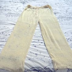 Off White Crochet Drawstring Beach Pants Size M Never Worn White Bohemian Bottoms With Drawstring, Bohemian White Drawstring Bottoms, Bohemian Drawstring Bottoms For Beach Season, Beach Wide-leg Pants With Drawstring, Beachwear Bottoms With Drawstring For Festival, Beige Beachwear Bottoms For Beach Season, Tie-side Drawstring Bottoms For Day Out, Drawstring Tie-side Bottoms For Day Out, Spring Drawstring Pants With Tie-side Bottom