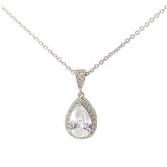 "Our Auden necklace is a pendant style design with a pear shaped center stone, surrounded by a halo of pavé set crystals. A classic, timeless design perfect for any occasion. - Made with clear simulated diamond stones - Available in silver, gold, or rose gold finish - Chain is 18\" length with a 2\" extender - Pendant measures 1\" length, 1/2\" width - Center stone measures 12mm x 9mm - Lightweight, easy to wear - Nickel and lead free - Securely packaged in a signature gift box with microfiber storage pouch - Easy returns SHOP THE COLLECTION: https://www.etsy.com/shop/TigerlillyCouture PACKAGING: Arrives in a custom Tigerlilly box, perfect for gifting and storing the jewelry. Printed receipts are not included in the box. You may print a receipt directly from Etsy for your records. If it is Classic Teardrop Pendant Bridal Necklace, Elegant Teardrop Necklace With Sparkling Stones, Teardrop Pendant Bridal Necklace In Crystal For Formal Occasions, Formal Bridal Necklace With Teardrop Crystal Pendant, Wedding Pear-shaped Necklace With Halo Setting, Pear-shaped Necklace With Halo Setting For Wedding, Classic Teardrop Crystal Necklace, Elegant Teardrop Pendant Drop Necklace With Sparkling Stones, Cubic Zirconia Teardrop Pendant Bridal Necklace