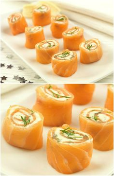 small rolls with cream cheese and herbs on them are sitting on a white platter