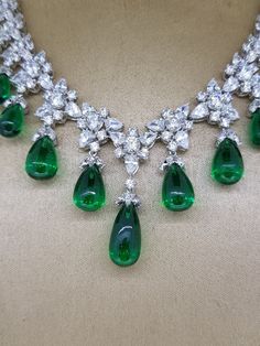 Luxury Emerald Gemstone Necklace For Formal Occasions, Luxury Emerald Necklace With Jewels For Formal Occasions, Luxury Emerald Necklace With Jewels For Formal Events, Luxury Emerald Necklace For Formal Events, Luxury Hallmarked Emerald Gemstones, Dazzling Formal Emerald Gemstone Necklace, Hand Set Emerald Pendant Necklace For Formal Occasions, Hand-set Emerald Pendant Necklace For Formal Occasions, Exquisite Hand-set Emerald Necklace For Formal Occasions