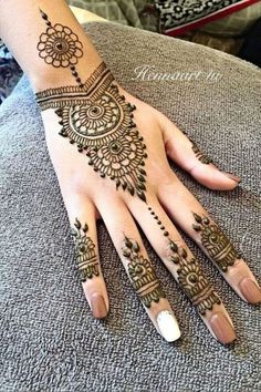 a henna tattoo on someone's hand