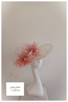 Striking, upturn slice disc hatinator in ivory sinamay.  A pair of  rose pink  feather flowers, with contrasting ivory goose biot,  take centre stange as they sit in circle of  rose goose feathers, with dancing coq tips in rose and ivory.    Sits on a headband.  The base is also available in other colours which can be embellished to complement. ''This item has sold, however, similar pieces can be made in a variety of colours.  Please ask for details.  As every piece is handmade, some differences Luxury Pink Spring Fascinator, Pink Hatinator, Horse Race Hats, Bride Fascinator, Royal Ascot Ladies Day, Ascot Ladies Day, Bride Hat, Flower Fascinator, Melbourne Cup