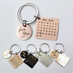 a set of six keychains with different designs and date options on each one