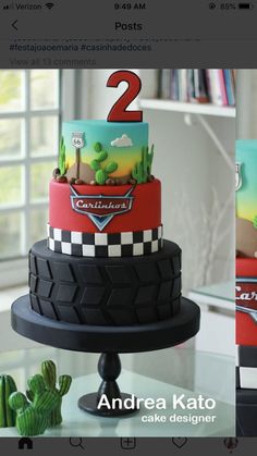 two tiered cake with cars and cactus on top