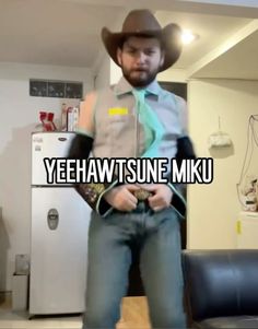 a man wearing a cowboy hat standing in front of a refrigerator with the words yeehawt sune miku on it