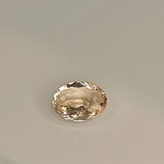 Here we have a beautiful natural oval cut light champagne sapphire  - this earth mined natural sapphire is untreated and unheated - it is just as mother nature made it having been only faceted and polished. No modern treatments here! This gem sapphire is untreated and unheated - this is the natural color as it was mined! A Gemological Report is included. Free tracked postage worldwide.  This sapphire measures 6.63mm by 5.15mm by 2.69mm approximately  It weighs 0.55carats approximately  The color Fine Jewelry Oval Topaz Gemstones, Oval Yellow Gold Topaz Gemstones, Gold Oval Gemstones With Brilliant Cut, Classic Oval Faceted Gemstones, Classic Faceted Oval Gemstones, Classic Oval Citrine Gemstones, Oval Faceted Gemstones For Fine Jewelry, Elegant Oval Topaz Gemstones, Oval Topaz Gemstones For Wedding