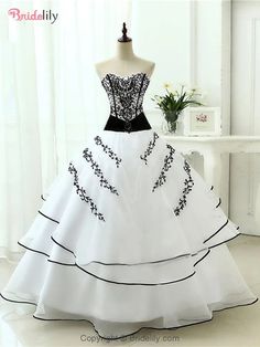 a white and black wedding dress on a mannequin