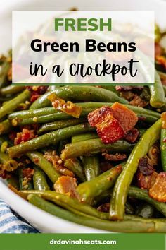 fresh green beans in a crockpot with bacon on top and the words, fresh green beans in a crockpot