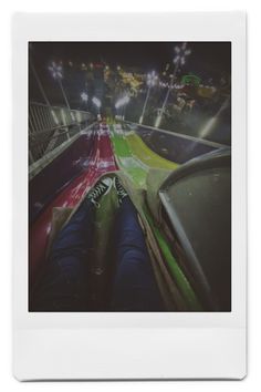 an image taken from the back seat of a car looking down at fireworks in the sky