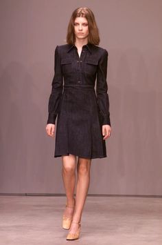 This amazing MIU MIU dress is from the Fall 2001 Collection and was featured in the runway show! *Y2K Vintage *Dark blue denim *Collared neckline *Puff sleeves *Snap button closure on bodice *Box pleat detail on skirt *Side zipper *Pockets on bodice *Knee length *100% cotton (no stretch) *'Miu Miu' brand *Excellent vintage condition  *Italian Size 44- coverts to US Size 8/Medium *Please note fit is tight in bodice area This item has been laundered and is ready to wear! Please email me with any q Fitted Long Sleeve Denim Dress For Work, Elegant Knee-length Denim Dress For Work, Elegant Dark Wash Dress For Work, Elegant Dark Wash Dresses For Work, Elegant Long Sleeve Denim Dress, Fitted Denim Dress For Work, Elegant Fitted Denim Dress For Fall, Dark Wash Long Sleeve Dresses For Work, Knee-length Dark Wash Dress For Work