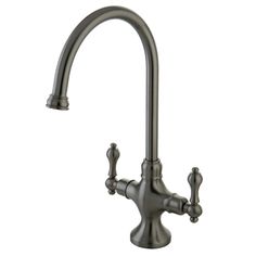 an antique style faucet with two handles and nozzles on the side