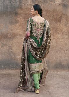 Buy Pakistani Green Wedding Dress in Kameez Trouser Style, a traditional masterpiece adorned with embroidery work, floral designs, and embellishments. Elegant Jamawar Salwar Kameez For Wedding, Elegant Jamawar Lawn Suit For Wedding, Anarkali Lawn Suit For Wedding With Traditional Drape, Designer Jamawar Lawn Suit With Intricate Embroidery, Traditional Drape Lawn Suit With Dabka Work For Wedding, Eid Wedding Traditional Drape Lawn Suit, Wedding Salwar Kameez With Intricate Embroidery In Jamawar, Lawn Suit With Intricate Embroidery In Chinon, Unstitched Jamawar Suit With Intricate Embroidery For Wedding