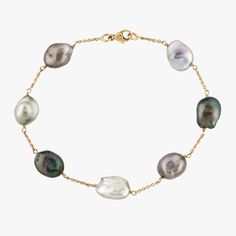 Add a timeless, captivating touch to your wardrobe with this 9-10mm Tahitian Keshi Pearl Station Tin Cup Chain Bracelet. Handcrafted with 14K yellow gold chain and finished with a lobster clasp, this bracelet will work perfectly for wrist size 6-6.7" (up to 17cm), bracelet showcases radiant, naturally colored keshi pearls that range from silvery blue to olive and dark emerald green. Perfect for both special occasions and day-to-day accessorizing, this statement piece pairs effortlessly with any look, while its luster promises to captivate those who take notice. For more information about keshi, pleasevisit my Pearl Blogwhere you can read further details. Each piece of our jewelry is unique and individually photographed. You will receive the exact item depicted in these images. Ready to shi Elegant Luxury Tahitian Pearl Bracelets, Keshi Pearl Bracelet, Cup Chain Bracelet, Tin Cup, Dark Emerald Green, Silvery Blue, 7 Up, Pearls Jewelry, Keshi Pearls