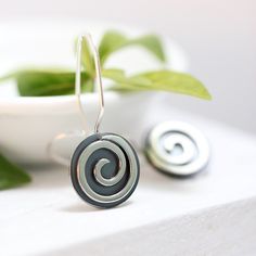 "These earrings are part of my spiral series. They are handcrafted of sterling silver with sturdy 19 gauge ear wires that clip securely in the back. They measure 5/8\" in diameter and about 1 1/8\" in length, and have a bright, shiny finish. I will ship these earrings via USPS First Class Mail within 3-5 days of receipt of payment." Spiral Earrings With Ear Wire As Gift, Spiral Earrings With Ear Wire For Gifts, Spiral Single Earring Gift, Spiral Single Earring As Gift, Nickel Free Spiral Earrings For Everyday, Handmade Spiral Earrings As Gift, Unique Spiral Earrings For Gift, Nickel-free Spiral Earrings For Everyday, Spiral Single Earring For Everyday Wear