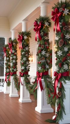 christmas garlands and pine cones are on the porch