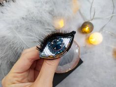 "Beautiful eye brooch is lovely handmade by me. 💓 This beautiful hand embroidered evil eye brooch took hours of precision and elaborate embroidery work. SIZE eye ~ 1,38\" x 2,36\" ( 3.5 cm x 6 cm) MATERIALS Made of czech seed beads and japanese seed beads, glass crystal, glass beads. Back side made of eco leather. Beaded jewelry requires careful and loving care. Avoid contact with hairspray, perfume, water, bleaches & lotions. Avoid over exposure to humidity, heat & sun. Gently wipe you Handmade Blue Brooches For Gift, Handmade Blue Pins For Gifts, Bohemian Brooch Pins For Gifts, Handmade Bohemian Brooch For Gifts, Handmade Bohemian Brooch As Gift, Unique Embroidered Brooch For Gift, Handmade Bohemian Brooches As Gifts, Bohemian Handmade Brooches As Gifts, Unique Embroidered Brooches For Gifts