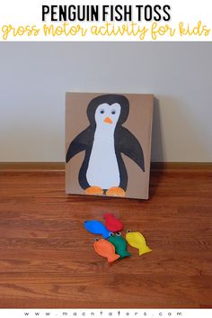 penguin fish toss game for kids to play on the floor with their own paper cut outs