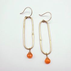 Simple brass oval earrings with a pop of sunny orange carnelian.  Gold fill earwires 2.75 inches from top of earwire Gold Carnelian Earrings With Ear Wire, Carnelian Gold Earrings With Ear Wire, Oval Earring, Gold Filled, Etsy Earrings, Dangle Drop Earrings, Brass, Orange, Drop Earrings