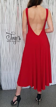 "Dress made of soft red elasticated maglin, boat neckline and plunging back neckline. Flared line with wide split on the right side. It can also be done with rear adjustable intersections. Possibility to make it in other colors or patterns. Contact us for information. www.tango-s.com - info [!at] tango-s.com TANGO'S offers you exclusive and original models, garments of refined and unique elegance, tailoring carefully curated in every detail, made in a rigorous \"Made in Italy\" combining Quality Cowl Back Evening Dress For Gala With Opening, Gala Evening Dress With Cowl Back, Party Dress With Cutout Back, Low Back Ruched Backless Dress For Gala, Party Evening Dress With Cowl Back And Ruched Detail, Party Evening Dress With Ruched Cowl Back, Backless Dress With Ruched Detail For Gala, Stretch Maxi Length Backless Cocktail Dress, Stretch Backless Maxi Dress For Cocktail