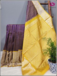 Venkatagiri silk/pattu Saree is woven in Venkatagiri of Nellor district in the Indian State of Andra pradesh. It was registered as one of the geographical indications from Andhra Pradesh. Venkatagiri sarees are known for their fine weaving,fine quality and workmanship. This beautiful rich silk saree in deep violet with small checks in copper zari and buttas in silk zari all over the body. The contrast yellow pallu and border with silver zari compliments the saree. The yellow blouse piece matches Purple Transitional Dupatta For Puja, Purple Dupatta For Puja And Transitional Season, Transitional Purple Saree With Cutdana Details, Diwali Purple Handloom Saree, Purple Banarasi Silk Handloom Saree, Purple Zari Weaving Saree For Puja, Purple Handloom Saree For Puja, Transitional Purple Dupatta With Zari Weaving, Purple Saree With Weaving Work