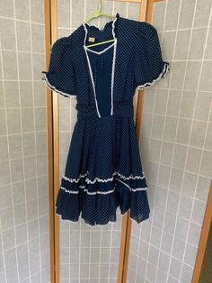 "Navy western square dance dress with little white polka dots. Has a built in belt to tighten at the waist. Zips up the back Bust: 36\" Waist: 25 without tying   Hips: free Shoulder to hem: 37\"" Square Dance Dress, Square Dance Dresses, Vintage Polka Dot Dress, Dots Dress, Square Dance, Square Dancing, White Polka Dot Dress, Dance Dress, Ruffled Maxi Dress