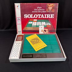 the game solitaire is in its original box and ready to be played with friends