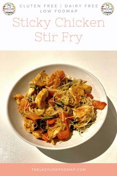 chicken stir fry in a white bowl with text overlay that reads gluen free dairy - free sticky chicken stir fry