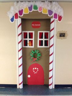 a door decorated to look like a gingerbread house