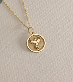 14K Real Solid Gold phoenix gold necklace ● Material of pendant: Solid Gold 14k ( REAL GOLD ) ● Metal Stamp: 14L ( REAL GOLD ) ● The pendant is available in 6 sizes: - 14,0 mm / 0,55 inches ( Diameter ) In the photos - 15,3 mm / 0.60 inches ( Diameter ) - 16,5 mm / 0,65 inches ( Diameter ) - 19,1 mm / 0,75 inches ( Diameter ) - 21 mm / 0,82 inches ( Diameter ) - 23 mm / 0.90 inches ( Diameter ) ( In the photos the size is 14mm / 0.55 inches Diameter ) ( Jump Ring inner diameter: 4 mm ) ● Materia Phoenix Bird, Bird Necklace, Bird Pendant, Amber Stone, Garnet Rings, Necklace Personalized, Gold Charm, Jump Rings, Metal Stamping