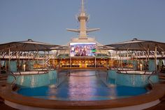 an outdoor pool on the deck of a cruise ship