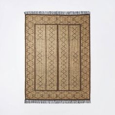 a piece of woven material with fringes on it