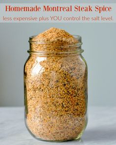 a glass jar filled with sand sitting on top of a table