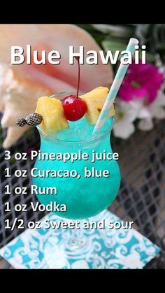 a blue hawaiian drink with pineapple juice, curaco blue and cherries