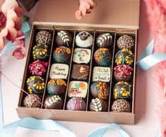 a box filled with chocolates on top of a table