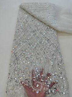 This high quality Fabric is measured in 5 Yards With Embroidered Beading and Sequin. It is soft, very delicate and beautiful. This high Quality Fabric is made with Fashion embroidered rhinestones can be used in making party wedding dresses, skirts, shawls, scarves and other other fashion apparels as you would like. Size : Length : 5 yards (180 inch). Width: 50 inch (Please allow slight deviation for the measurement data ,±1 inch) Material: 100% Polyester, Tulle Lace Fabric, Eco-Friendly embroide Diy Teen, Jeweled Bouquet, Fashion Figure, Sewing Wedding Dress, Beaded Lace Fabric, Sequin Decor, Embroidered Lace Fabric, Couture Embroidery, Luxury Fabric