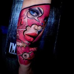 a woman's leg with a colorful face and eye