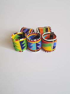 These stylish beaded maasai bracelet are made using fine beads. Colorful and bright. You get All 9 bracelets like shown above. They have leather finishing with 3 buttons for closure. **Buy multiple items and pay shipping for 1 item only.The rest ships free. Multicolor Beaded Bangle Wristband, Multicolor Beaded Braided Bracelets, Multicolor Braided Bead Bangle Bracelet, Multicolor Braided Bracelet Bangle, Multicolor Braided Bangle Bracelet, Handmade Multicolor Beaded Bangle Bracelets, Handmade Multicolor Wristband, Unique Multicolor Hand Wrapped Beaded Bracelets, Multicolor Round Beaded Wristband