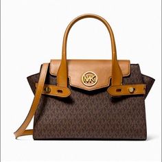 Michael Michael Kors Carmen Medium Logo And Faux Leather Belted Satchel. Brown. New With Tag Designer Brown Satchel With Turn-lock Closure, Designer Brown Bag With Turn-lock Closure, Chic Bags With Leather Trim And Signature Coated Canvas, Chic Signature Coated Canvas Shoulder Bag For Office, Chic Office Shoulder Bag In Signature Coated Canvas, Chic Coated Canvas Bags For Fall, Designer Faux Leather Satchel With Double Handle, Leather Bags With Turn-lock Closure And Double Handle, Leather Bag With Turn-lock Closure And Double Handle