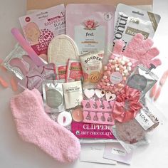 a box filled with lots of pink items