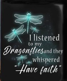 a black coffee mug with two dragonflies on it and the words i listened to my dragonflies and they whipped have faith