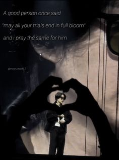 a person making a heart shape with their hands in front of him and the caption reads, a good person once said may all your trials end in full bloom and pray