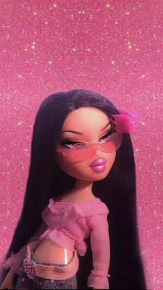 a close up of a doll with long black hair and pink glasses on her face