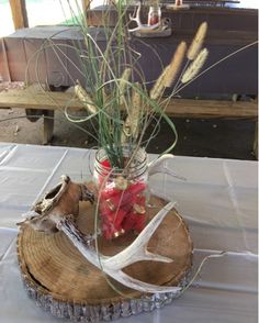 a vase filled with flowers sitting on top of a table