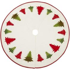 a round christmas tree skirt with red, green and white trees on the center circle