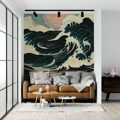 a living room with a couch, coffee table and large painting on the wall behind it