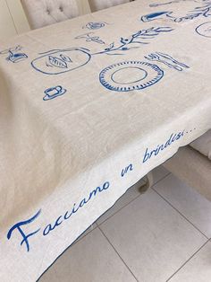 a white table with blue writing on it