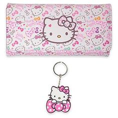 a hello kitty purse and keychain are on display