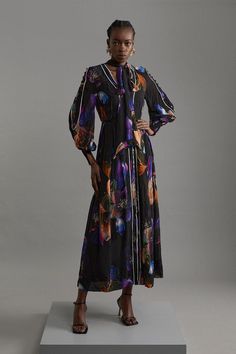 Experience Elevated Glamour In Our Maxi Dress, Which Features A Fit That Flares At The Waist, As Well As A Tie Accent And An Enticing Print. Style It With Strappy Heels For An Occasion Look Perfect For Wedding Guest Evenings, Race Days, And Formal Events. Printed Viscose Floral Border Print Maxi Dress Statement Abstract Print Deep V Neckline Unique Tie Accent Statement Flared Skirt Flattering Waistband Panel Long Balloon Sleeves Subtle Ombre Accents Petite Work Outfits, Petite Wedding Guest Dresses, Plus Size Workwear, Latest Maxi Dresses, Dresses Printed, Maxi Dress Collection, Outfits Petite, Petite Coat, Fall Outfits For Work