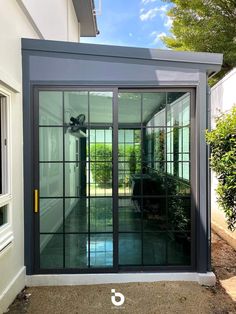 an open patio door with glass panels on the outside