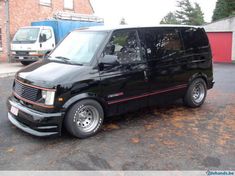 a black van parked in a parking lot